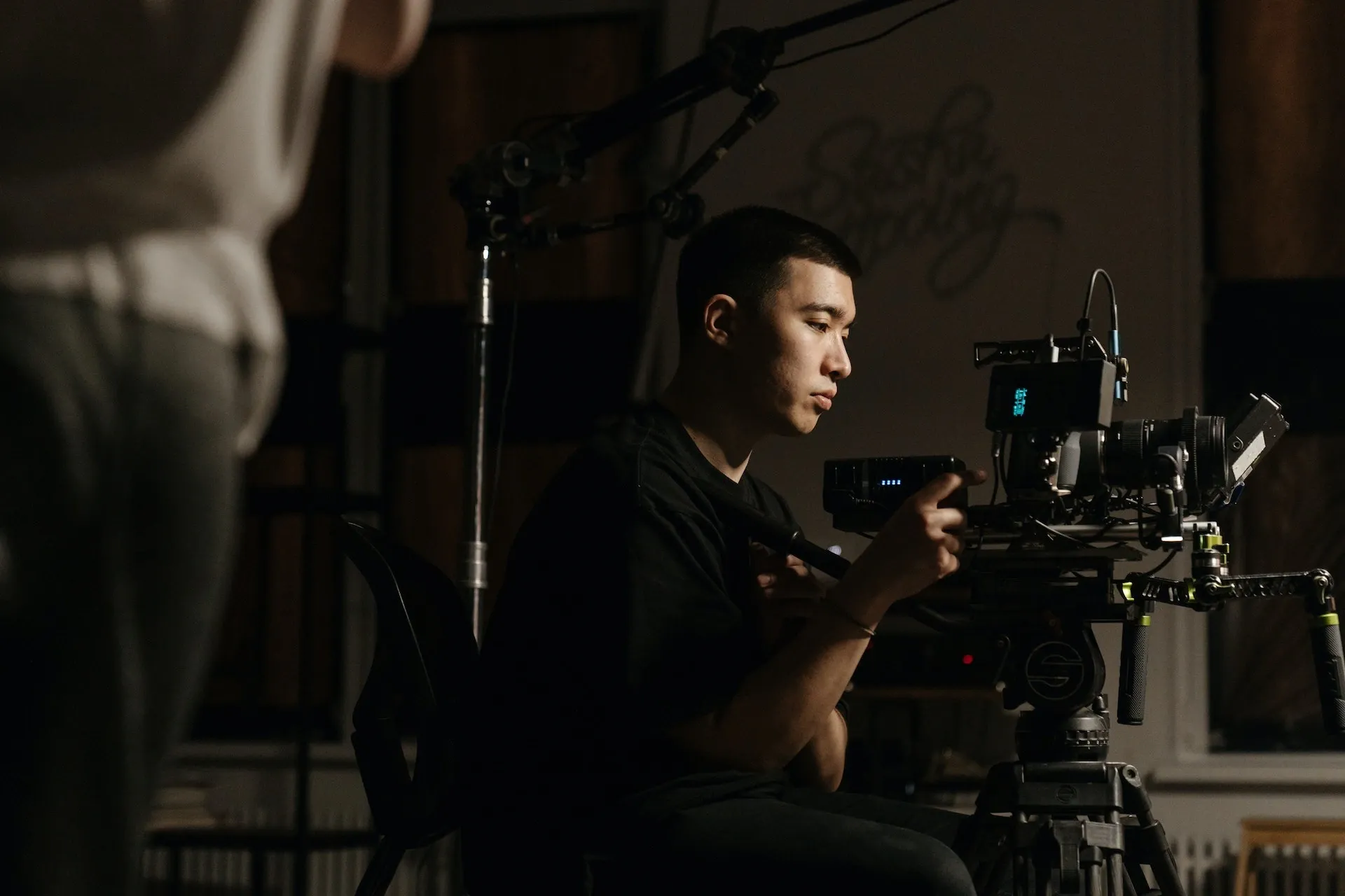 Man filming with follow focus