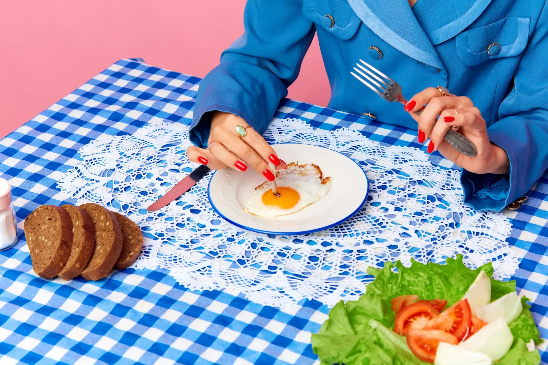 Woman sitting down to eat a meal 