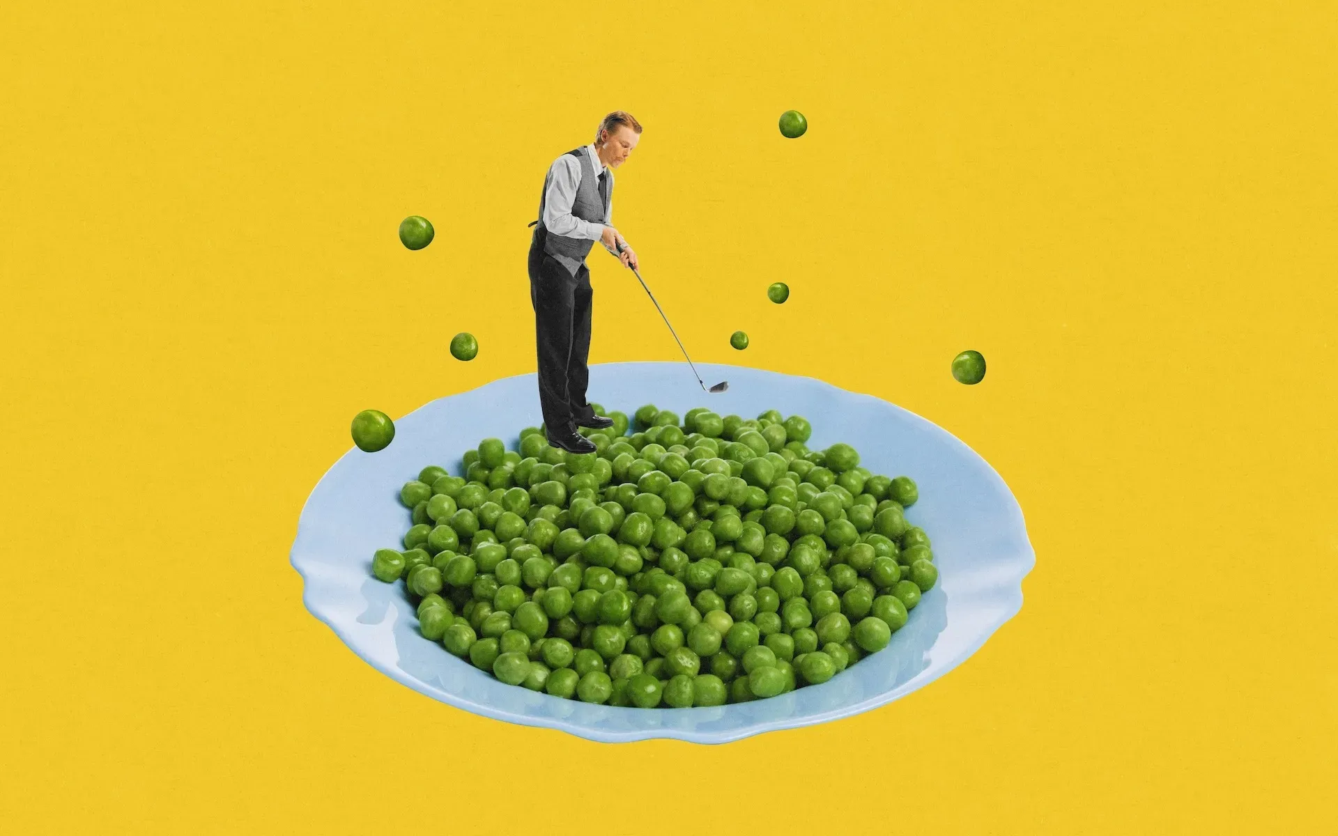 Playing golf on top of a plate of peas