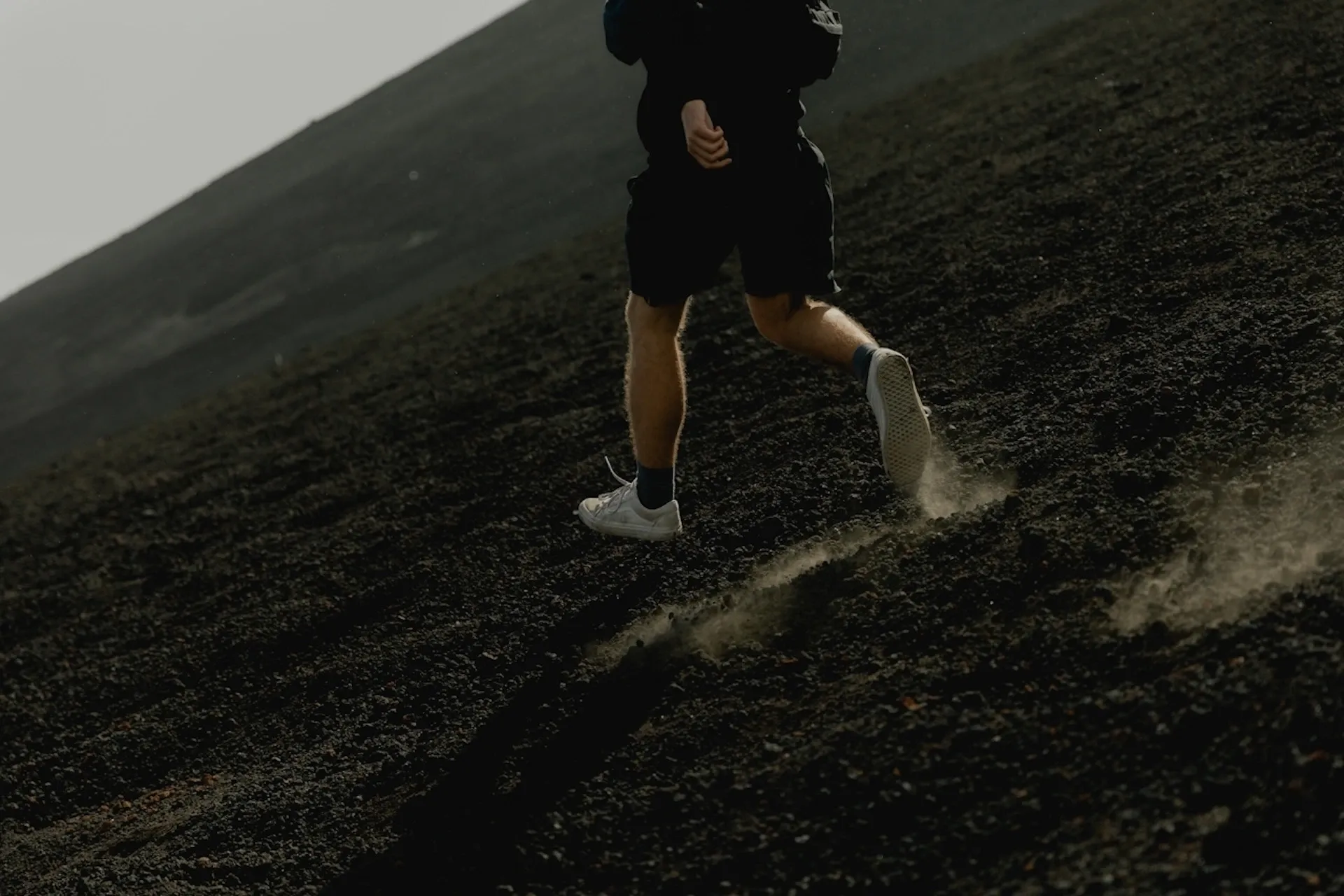 Man running down a cliff